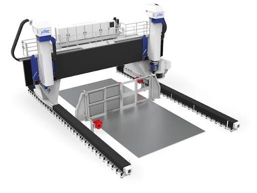 Industrial CNC gantry machine equipped with drag chain cable systems that safely route and protect electrical cables during automated cutting, milling, and precision manufacturing operations.