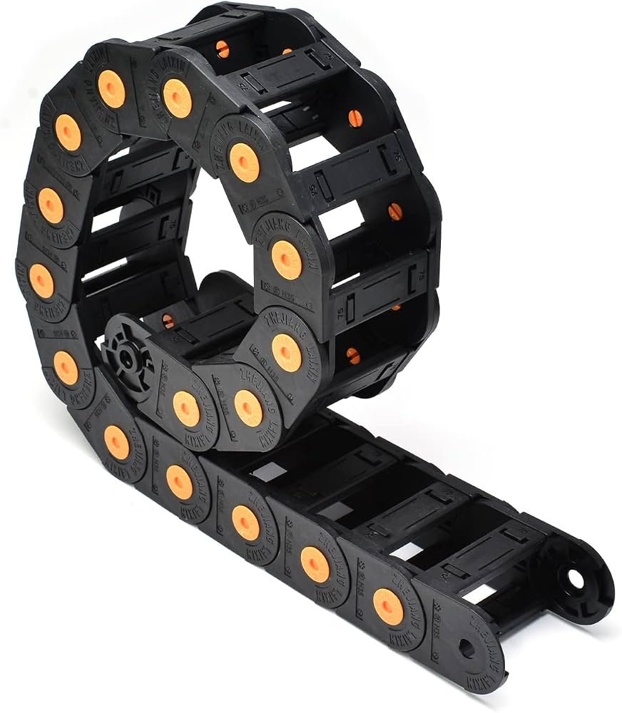 Black plastic drag chain cable carrier with orange pivot points, designed to protect and guide electrical cables and hoses in CNC machines, robotic systems, and industrial automation applications.