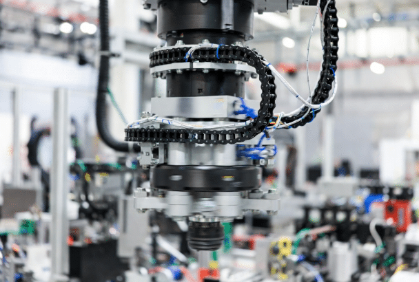 Multi-axis robot arm with flexible custom cables undergoing bending and torsion in industrial automation, demonstrating need for motion-compatible jacket and insulation materials