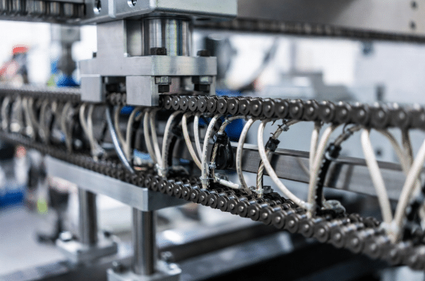 Industrial drag chain with high-flex cables installed on CNC or gantry system demonstrating optimized bending motion