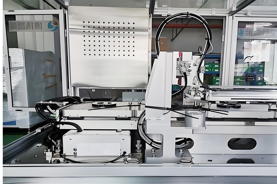 Close-up of black flexible cables routed inside an automated industrial machine, demonstrating durability and precision installation for servo or robotic applications
