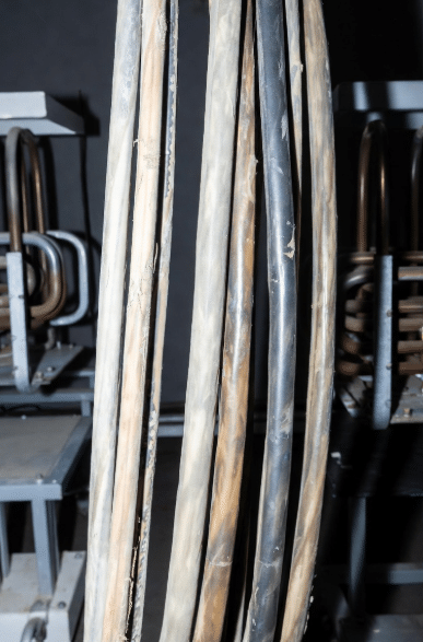 Close-up of silicone insulated cables exposed to high heat sources showing material condition and flexibility considerations for long-term thermal performance in factory applications