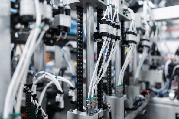Professional view of durable high-flex sensor and actuator cables properly routed on automated factory equipment, highlighting flexibility and reliable connections in industrial settings