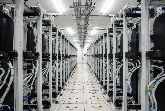 Clean cable management in a modern data center or control room with visible emergency pathways, illustrating benefits of halogen-free cables for reduced smoke and better visibility during fire events