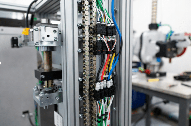 Well-maintained drag chain with strain-relieved servo cables demonstrating best practices for preventing common servo cable failures in automation systems