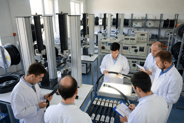 Professional view of a quality control laboratory testing high-temperature silicone cables with advanced equipment, representing rigorous compliance and testing processes in silicone cable manufacturing for OEM reliability