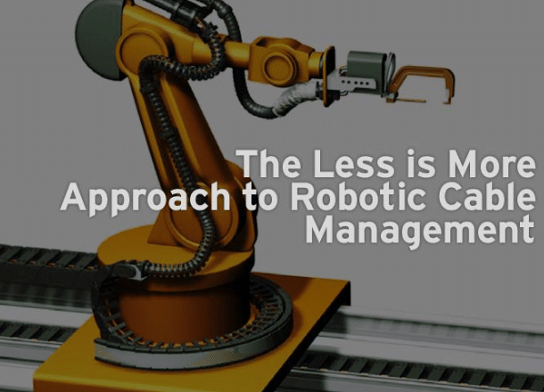 Industrial image of external dress pack and strain relief clamps on 6-axis robot arm demonstrating proper installation space management for torsion-rated cables
