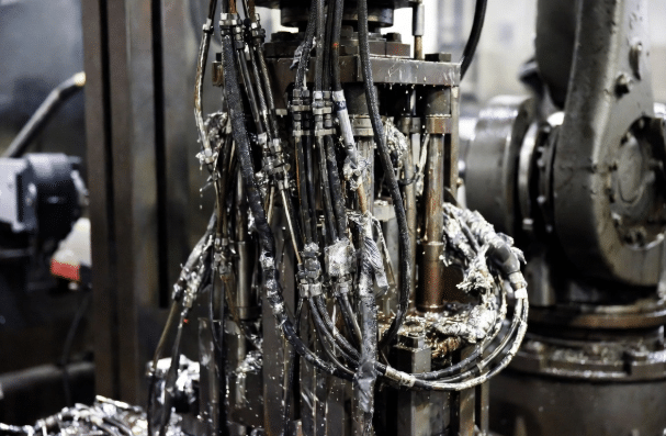 Robotic Cell Showing Oil Coolant and Spatter Exposure
