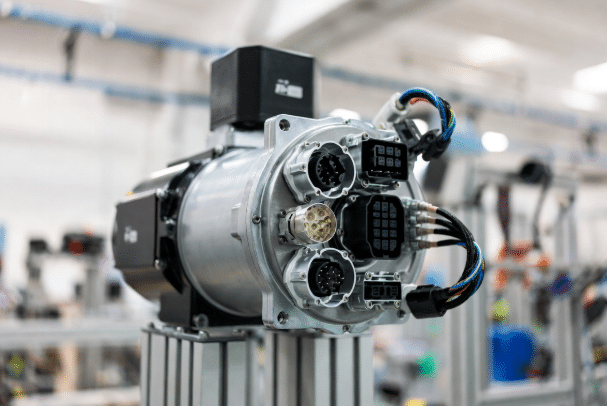 Close-up of servo motor equipped with multiple OEM connectors and high-flex cables in a professional automation factory environment, highlighting precise pinouts and engineering details for reliable motion control