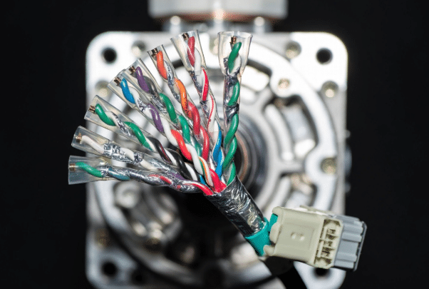 Close-up of servo encoder feedback cable highlighting twisted shielded pairs and connector for reliable signal transmission in motion control systems