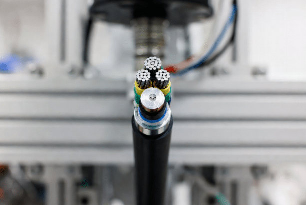 Detailed view of specialized torsion-friendly shield braiding and protective buffering films that maintain EMI shielding while allowing controlled twist in robotic cables