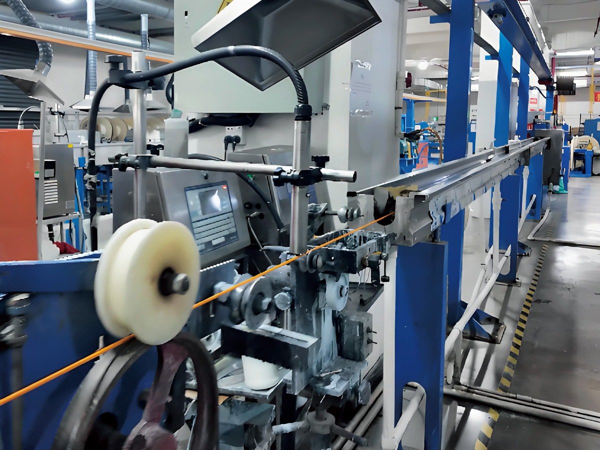 Automated high-speed production line at HULK factory, featuring precision tension control systems and continuous processing machinery ensuring consistent quality for mass cable manufacturing.