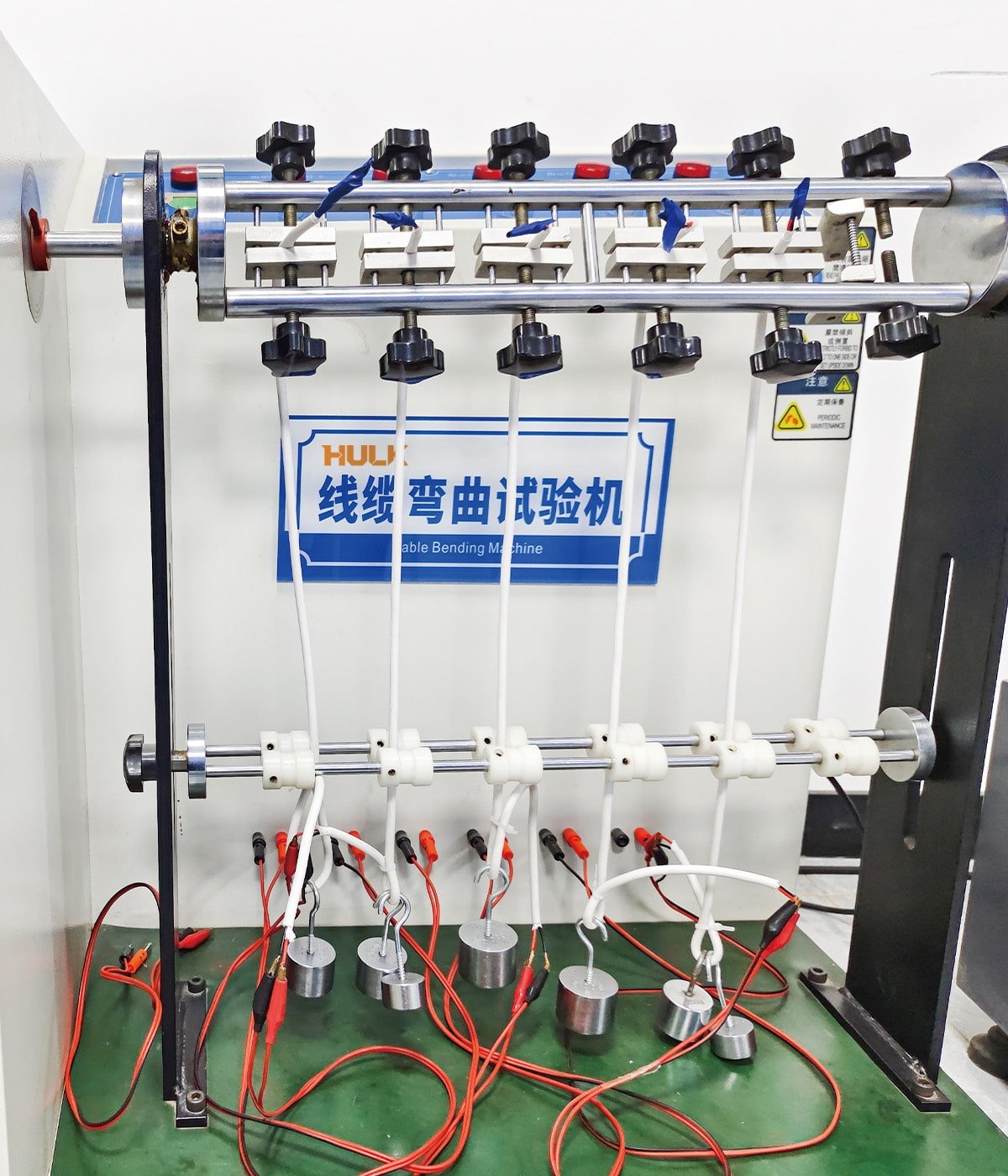 HULK cable bending test machine with multiple samples under load, demonstrating rigorous mechanical durability testing for industrial-grade cables.