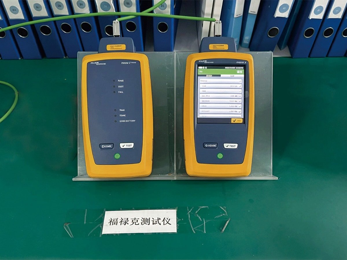 Two Fluke network cable testers displaying PASS results for HULK cables, verifying compliance with industry standards for data transmission performance; this certification ensures reliable high-speed connectivity in enterprise and industrial networking applications.