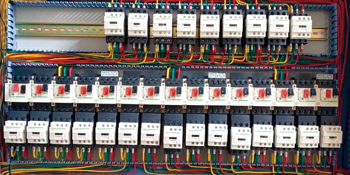 HULK industrial cables integrated into a complex electrical control panel, demonstrating high-density wiring and reliable power distribution for automated manufacturing systems.