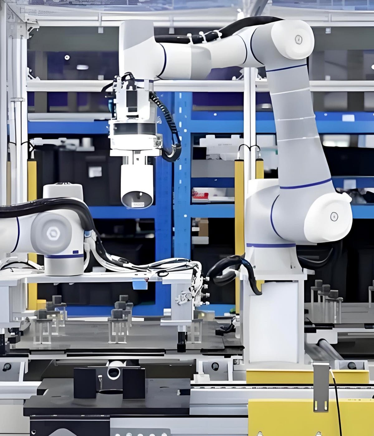 HULK flexible cables integrated into white collaborative robots working side-by-side with humans, engineered for safe human interaction, dynamic motion, and real-time signal feedback in light-industrial automation environments.