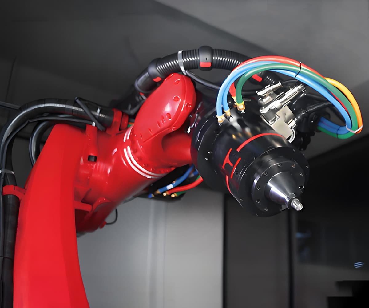 HULK high-flex multi-core cables routed through corrugated conduit into a robotic end-effector, engineered for compact space, high signal integrity, and continuous motion in precision automation applications.