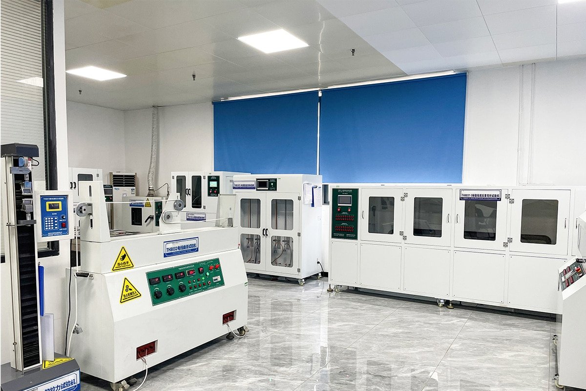 HULK cable testing lab featuring a cluster of specialized mechanical durability machines including TH8032 flexing tester and TH8027-3 low-temperature coiling unit; designed to simulate extreme physical stress conditions and validate cable integrity across temperature, frequency, and bending angle variables.