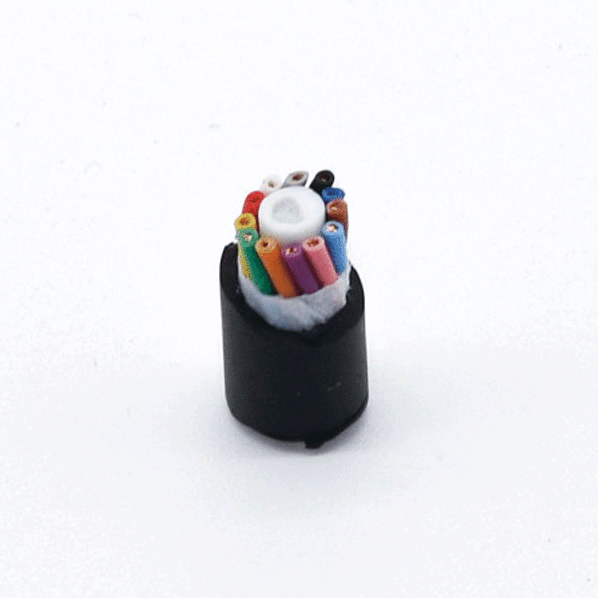 Close-up cross-section of a HULK multi-core control cable showing a black outer jacket, white non-woven filler layer, and distinctively color-coded internal wires (red, yellow, green, blue, etc.) surrounding a central white filler rope; the tight stranding and organized layout demonstrate superior structural integrity and ease of identification for complex wiring installations.