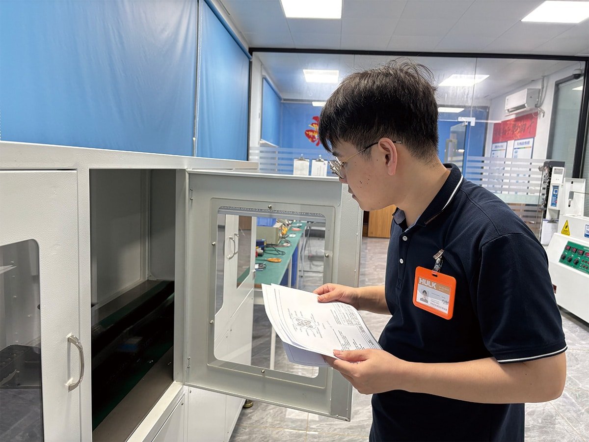 HULK engineer verifying test data against specifications inside the quality control lab, ensuring compliance with international standards for cable performance and safety.