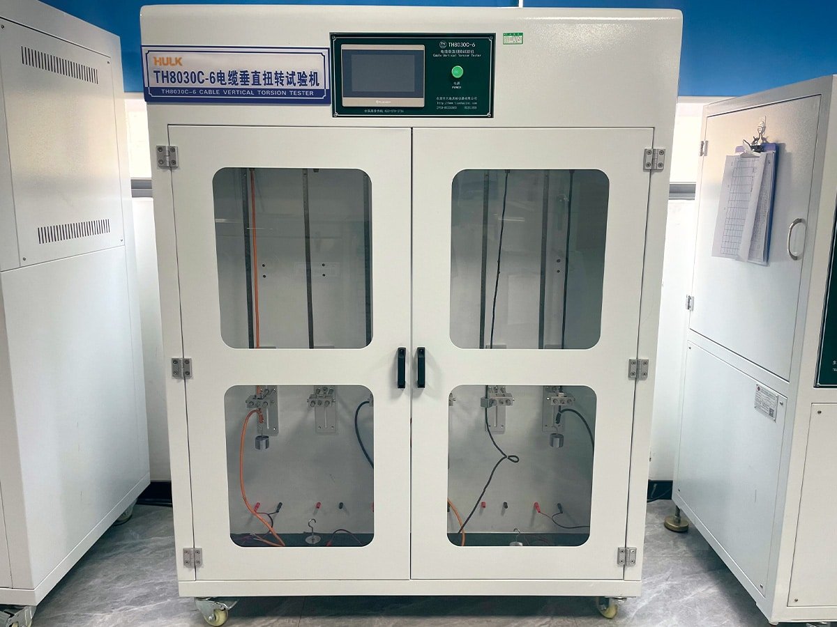 HULK TH8030C-6 cable vertical torsion tester in the lab, performing repeated twisting tests to validate cable structural integrity under rotational stress for cranes and rotating machinery.
