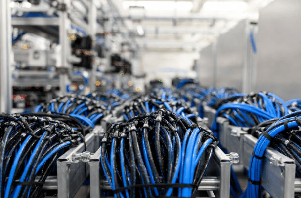 Professional view of bundled halogen-free LSZH industrial cables in clean cable trays within a high-tech data center or automation facility, highlighting engineering precision and fire safety compliance