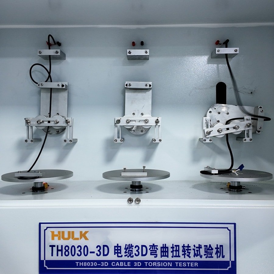 Hulk Cable TH8030-3D Cable 3D Torsion Tester with three precision fixtures performing simultaneous 3D bending and torsion on black cables to validate durability under complex multi-axis motion