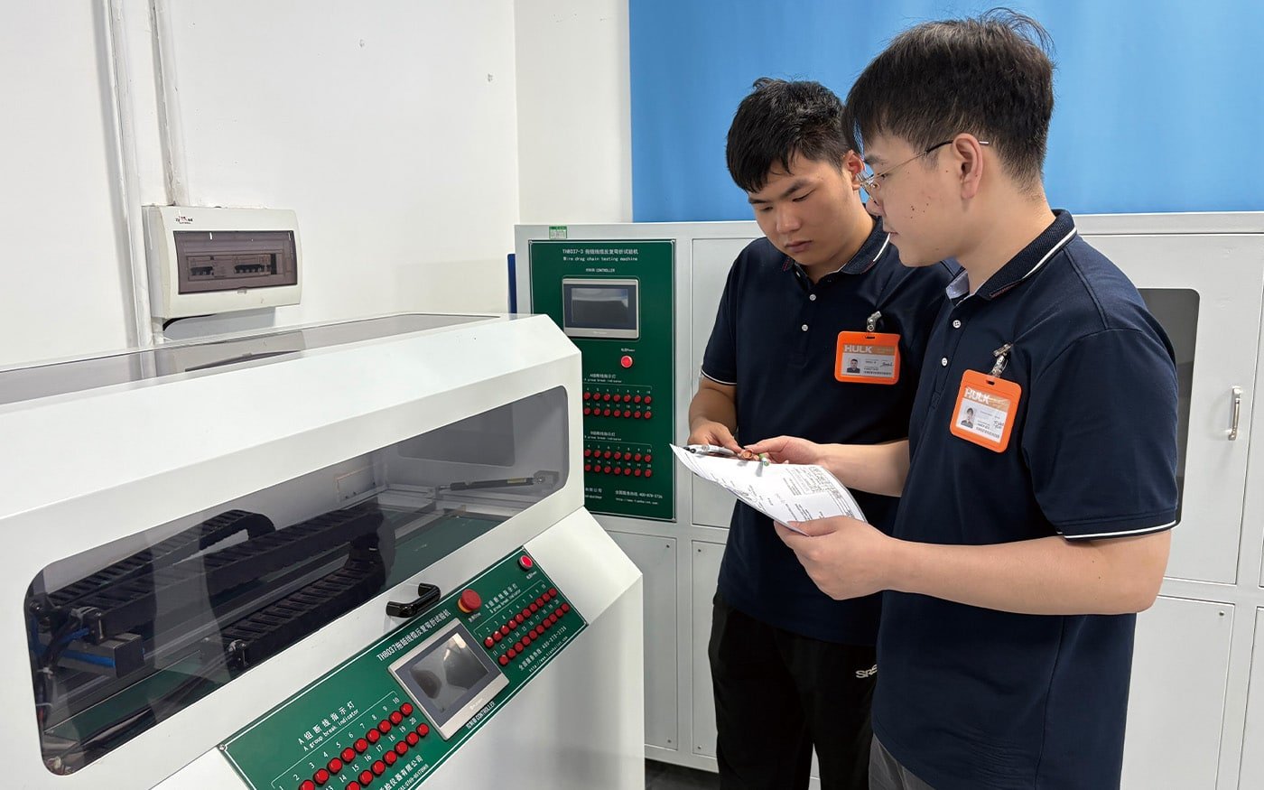 Hulk Cable engineers conducting drag chain cable flex life test using TH8037 machine, verifying durability of high-flex industrial cables under repeated bending cycles for robotics and automation applications