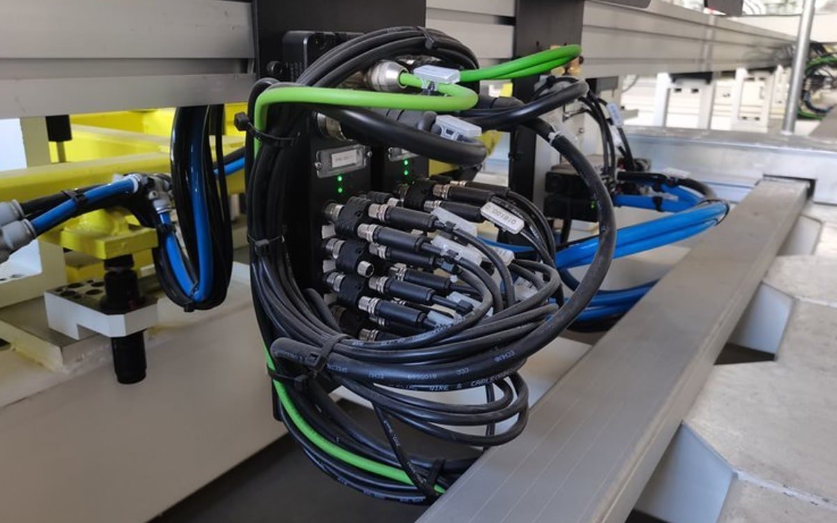 Hulk Cable distributed Profinet IO module with sensor junction box, featuring multiple circular connectors and black shielded cables for industrial automation signal acquisition and remote diagnostics