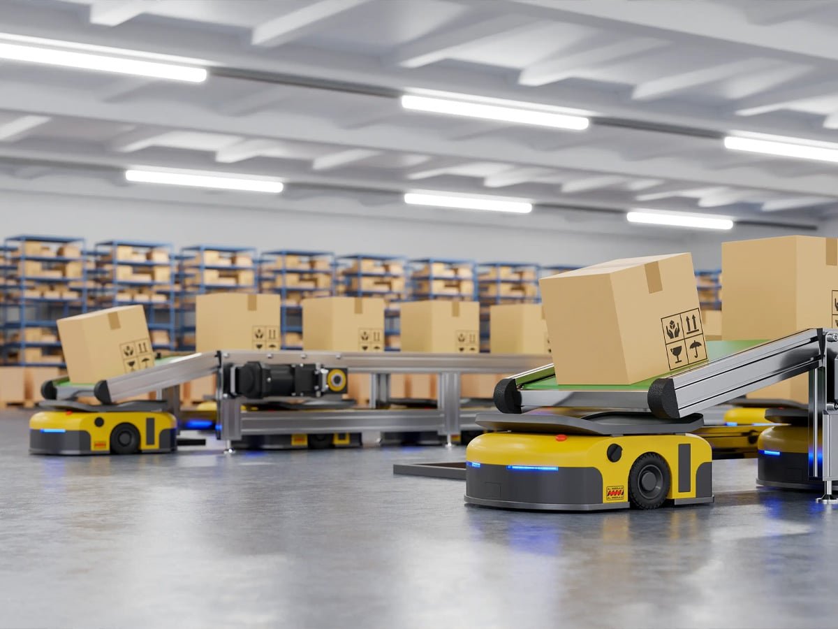 Yellow AGV robots transporting cardboard boxes via roller conveyors in smart warehouse, powered and controlled by Hulk cables for reliable power and data transmission in multi-vehicle collaborative logistics automation