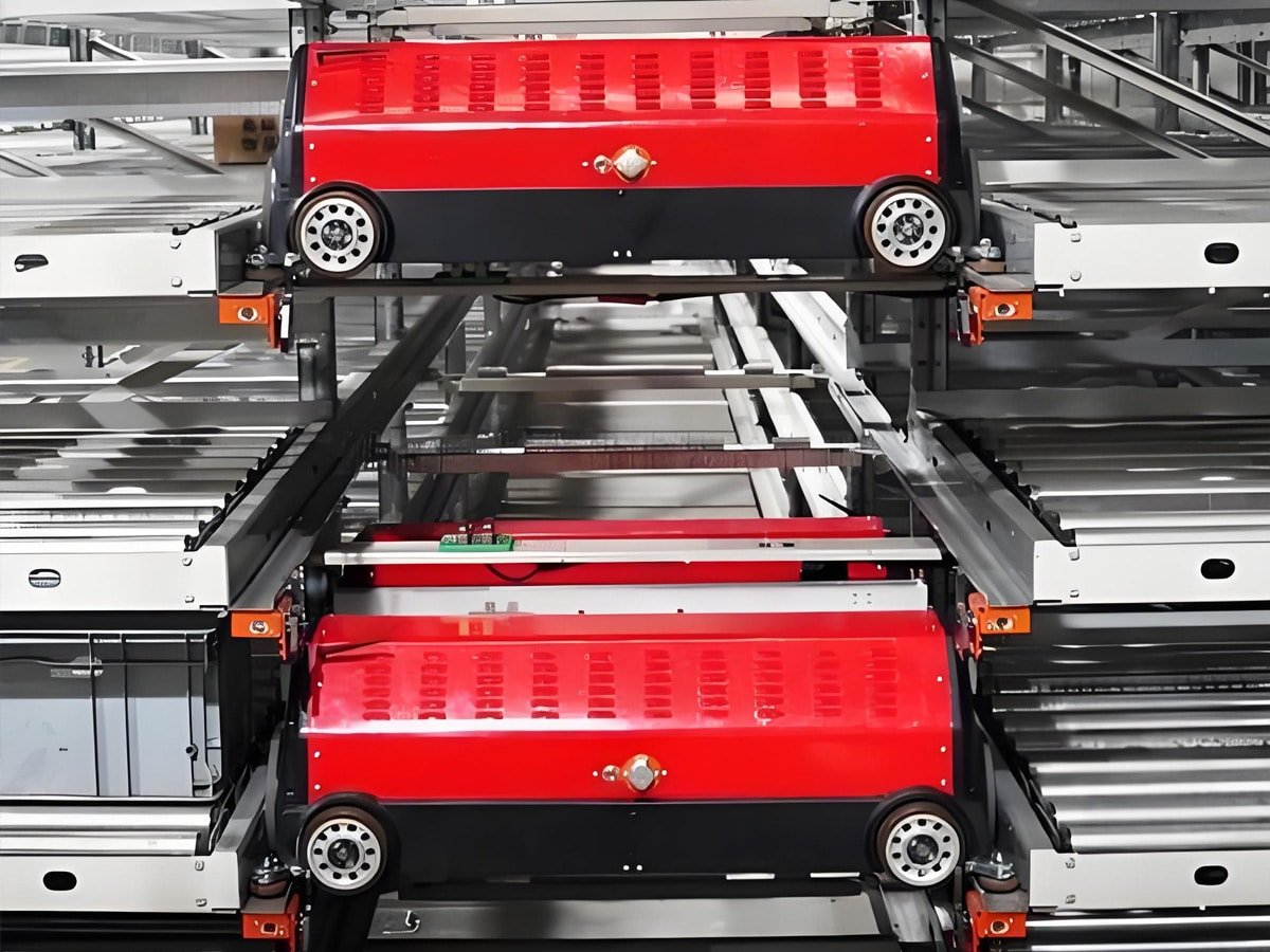 Red four-way shuttle robot operating in high-density automated warehouse, powered and controlled by Hulk cables for reliable power and data transmission in precision multi-directional material handling applications